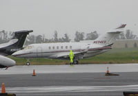 N694ES @ KAPC - Montfort Aviation (Eaton, CO) 2004 Raytheon Aircraft Hawker 800XP in spring showers @ Napa County Airport, CA - by Steve Nation