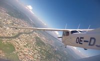 OE-DJW @ LOWG - Cessna making a steep turn over Graz before landing at LOWG, Austria - by Paul H