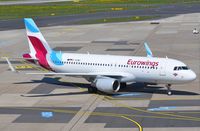 D-AEWD @ EDDL - Eurowings A320 pulling up to its gate. - by FerryPNL