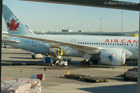 C-GHPT @ CYVR - Action scene - loading rear bay. Parked in domestic. - by Remi Farvacque