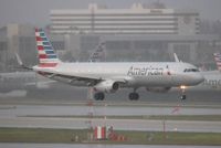 N121AN @ MIA - American landing in a thunderstorm - by Florida Metal