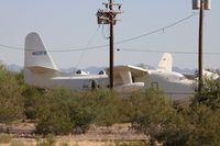 N122FB @ MZJ - Upset that this is the best quality that I could get of these former Chalks Albatrosses.  No way around those poles as there were bushes and many other obstructions in the way.  I was not there on a day I could get an airfield tour. - by Florida Metal