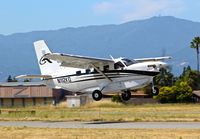 N112KQ @ KRHV - TWA Aviation LLC (Mill Valley, CA) 2014 Quest Kodiak departing with the infamous Mt. Umunhum in the background at Reid Hillview Airport, San Jose, CA. - by Chris Leipelt