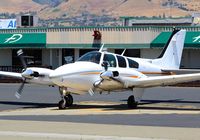 N70MB @ KRHV - California-based 1968 Beechcraft Baron 55 started up and preparing for taxi out and departure at Reid Hillview Airport, San Jose, CA. - by Chris Leipelt