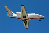 N582JS @ KSJC - Jet Suite Aviation landing with their 2010 Phenom 100 at San Jose International Airport, CA. - by Chris Leipelt