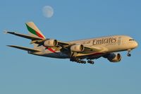 A6-EDR @ EGCC - Emirates passes by the moon on its way to LHR. - by FerryPNL