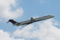 N958DN @ KSRQ - Delta Flight 2298 (N958DN) departs Sarasota-Bradenton International Airport enroute to Hartsfield-Jackson Atlanta International Airport - by Donten Photography