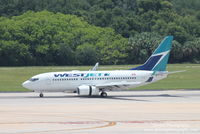 C-GUWS @ KTPA - WestJet Flight 1246 (C-GUWS) arrives at Tampa International Airport following flight from Toronto-Pearson International Airport