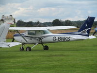 G-BNKS @ EGCV - club Cessna on grass - by magnaman