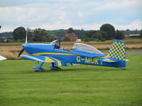 G-MUKY @ EGCV - on grass parking area - by magnaman