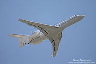 N933EY @ KSRQ - Bombardier Global 5000 (N933EY) departs Sarasota-Bradenton International Airport - by Donten Photography