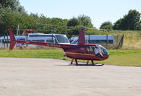G-HOCA @ EGTB - Robinson R44 Raven II at Wycombe Air Park. - by moxy