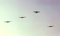 N900RW @ KOSH - 4 B-17's performing a missing man formation at Air Adventure 1993 Oshkosh. - by kenvidkid
