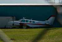 C-FJBD @ CYYE - Parked next to Villars Air hangar.