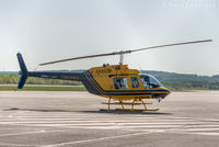 C-FNPW @ CYYE - Parked outside Qwest Helicopters hangar.