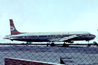 PH-DSO @ EGSS - Douglas DC-7C [45547] (Ex Martins Air Charter) Stansted~G 28/06/1975. From a slide. Taken through the fence. - by Ray Barber