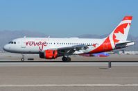 C-FYIY @ KLAS - Rouge A319 landing. - by FerryPNL