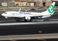 PH-HZL @ KPHX - Sun Country landing PHX Runway 26. Many previous paint schemes for 'HZL' - by aubergaz