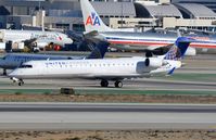 N716SK @ KLAX - United Express rush hour. - by FerryPNL