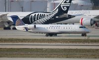 N984CA @ LAX - United Express - by Florida Metal