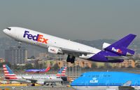 N396FE @ KLAX - Fedex MD10 lifting-off from LAX - by FerryPNL