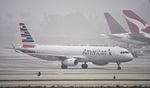 N103NN @ KLAX - Taxiing to gate at LAX on a foggy morning - by Todd Royer