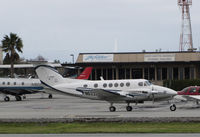 N622KM @ KSQL - K & M Equipment CO (Chatsworth, CA) 1981 Beech 200 taxiing for return flight to Southern California @ San Carlos Airport, CA - by Steve Nation