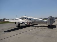 N1828D @ KRIR - 1952 Beech D18S on ramp @ iconic Flabob Airport, Riverside, CA (3 stars on wing flap) - by Steve Nation