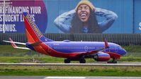 N705SW @ KOAK - Landing 28R at North Field Oakland Airport. - by Clayton Eddy