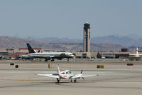 N65118 @ KLAS - Holding short of Runway 1L at Las Vegas. ATA 757-200 N526AT on taxi to the departure runway. - by Tom Vance