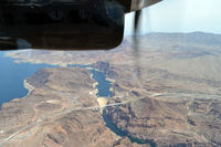 N228SA - Flying over Hoover Dam - by Micha Lueck