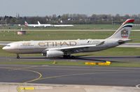 A6-EYM @ EDDL - Etihad A332 vacating the runway - by FerryPNL