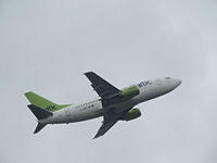 YL-BBE @ EBBR - AIR BALTIC departing in the rain - by fink123