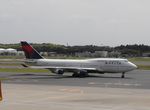 N667US @ RJAA - Taxying for departure - by Keith Sowter