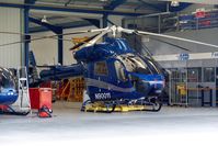 N90011 @ EGKA - Photo taken from the perimeter road looking into the main Fast Air hangar. Owned by Latium Helicopter Charters UK Inc Trustee. - by Glyn Charles Jones