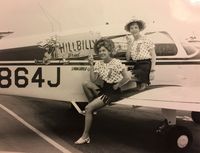 N864J - My Mother, Maybelle Fletcher, pictured here on the left, ready for a cross-country air race in about 1975-76. The sponsor was Hillbilly Bread therefore the corncob pipes! N864J Mother passed away at 92 yrs of age last year.  (Prob Hobby Airport) - by Sandy Fletcher Smith