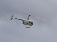 N555BN @ KOLM - Robinson R44 passing over the Olympia Airport - by Eric Olsen