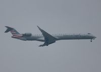 N952LR @ KDFW - At DFW. After a 45 minute hold because of severe storms, starting to land in heavy rain. - by paulp