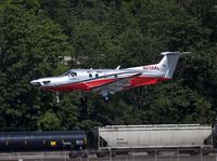 N213AL @ KBFI - Pilatus with Airlift Northwest landing at KBFI - by Eric Olsen