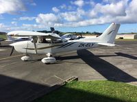 ZK-ELY @ NZNE - Parking up at North Shore - by magnaman