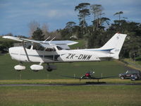 ZK-DMW @ NZNE - LANDING AT NORTH SHORT - by magnaman