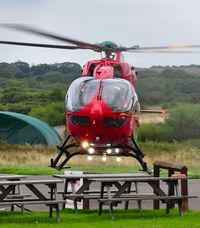 G-WENU @ EGFH - Visiting Wales Air Ambulance helicopter (Helimed 57). Based at Dafen, Carmarthenshire. - by Roger Winser