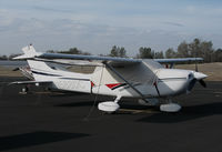 N588DC @ KAUN - Locally-based 1998 Cessna 182S Skylane under cover @ Auburn Municipal Airport, CA - by Steve Nation