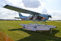 G-ESSL @ EGLM - Cessna 182R Floatplane at White Waltham. Explanatory note attached to starboard float. - by moxy
