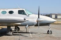 N821KB @ E16 - Locally-based 1966 Cessna 411 parked and rotting on the ramp at San Martin Airport, CA. - by Chris Leipelt