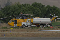 N1043T @ O69 - Croman Corp (White City, OR) 1982 Sikorsky S-61A behind fuel truck at the Petaluma Municipal Airport, CA temporary home base used by fleet of CALFIRE contracted helicopters to make water drops on the devastating October 2017 Northern California wildfires - by Steve Nation