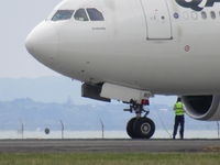 VH-EBO @ NZAA - held on runway for checks after landing with hydraulic warning - by magnaman
