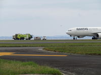 VH-EBO @ NZAA - getting ready to tow off runway - by magnaman