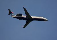 N220PS @ DAY - PSA Airlines {United Express/American Airlines} Canadair Jet CRJ-200ER, N220PS, approaches Runway 6 right at the Dayton International Airport on August 8, 2015 arriving from Philadelphia. Visit me by copy/paste: https://steemit.com/@rollie13 . - by Rollie Puterbaugh 2015