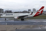 VH-EBN @ YSSY - TAXI TO A WET 16R - by Bill Mallinson